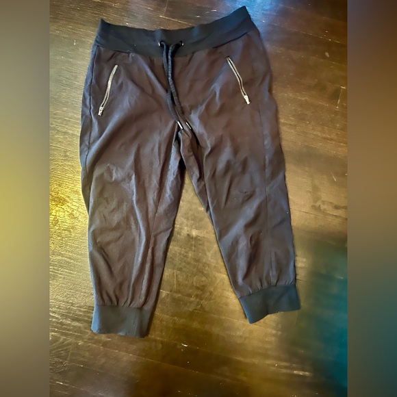 Athleta Women's Black Salutation Joggers with Zippered Pockets. Size 12p - Picture 2 of 5